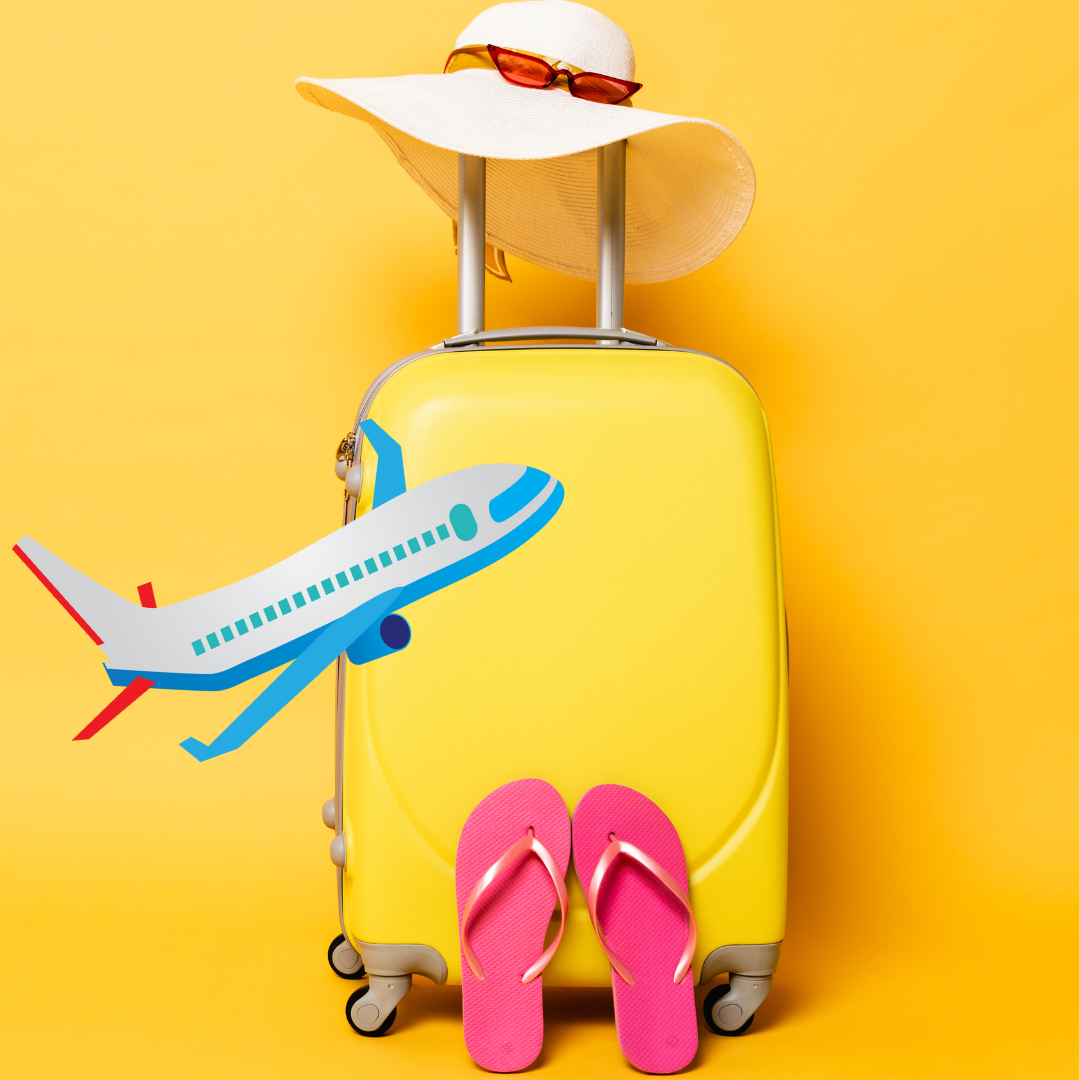 Yellow suitcase with a sun hat and travel accessories