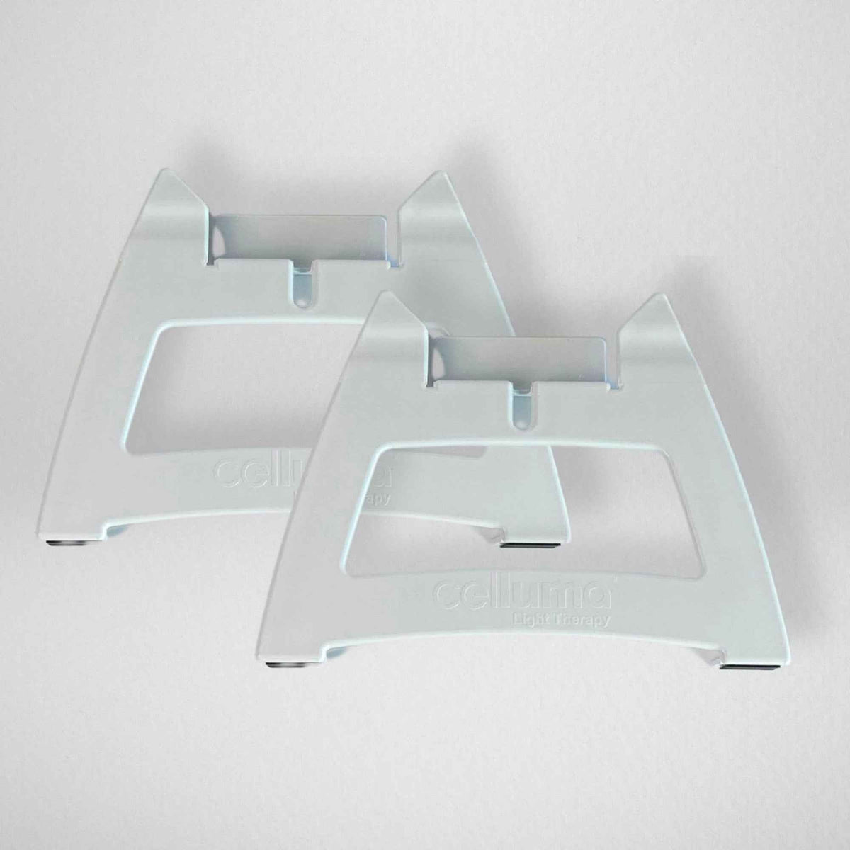 White supports for positioning a Celluma panel
