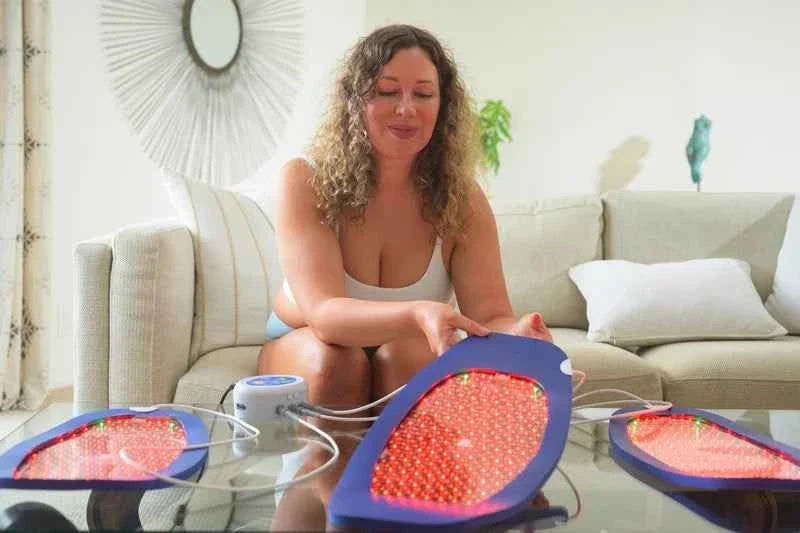 Woman arranging several Celluma panels on a table