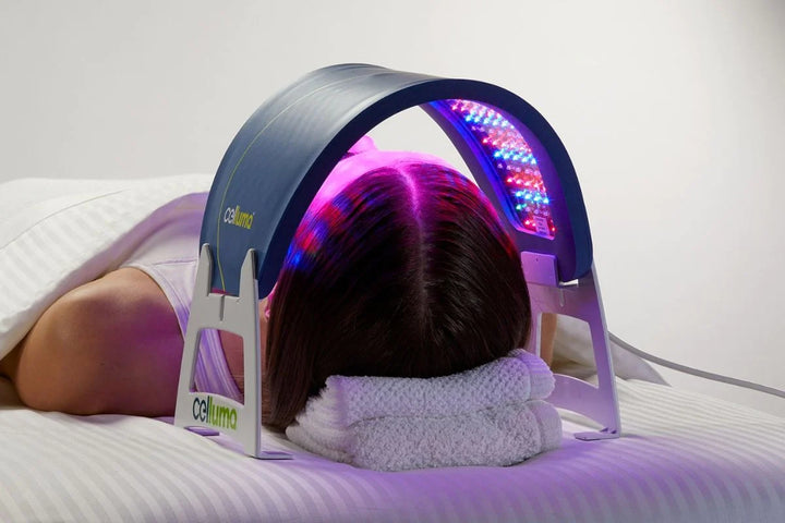 Celluma panel on supports above a facial treatment