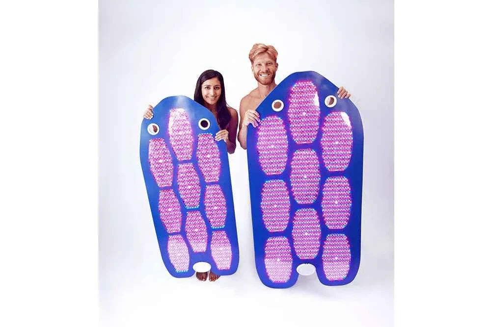 Two people holding full-length Celluma panels