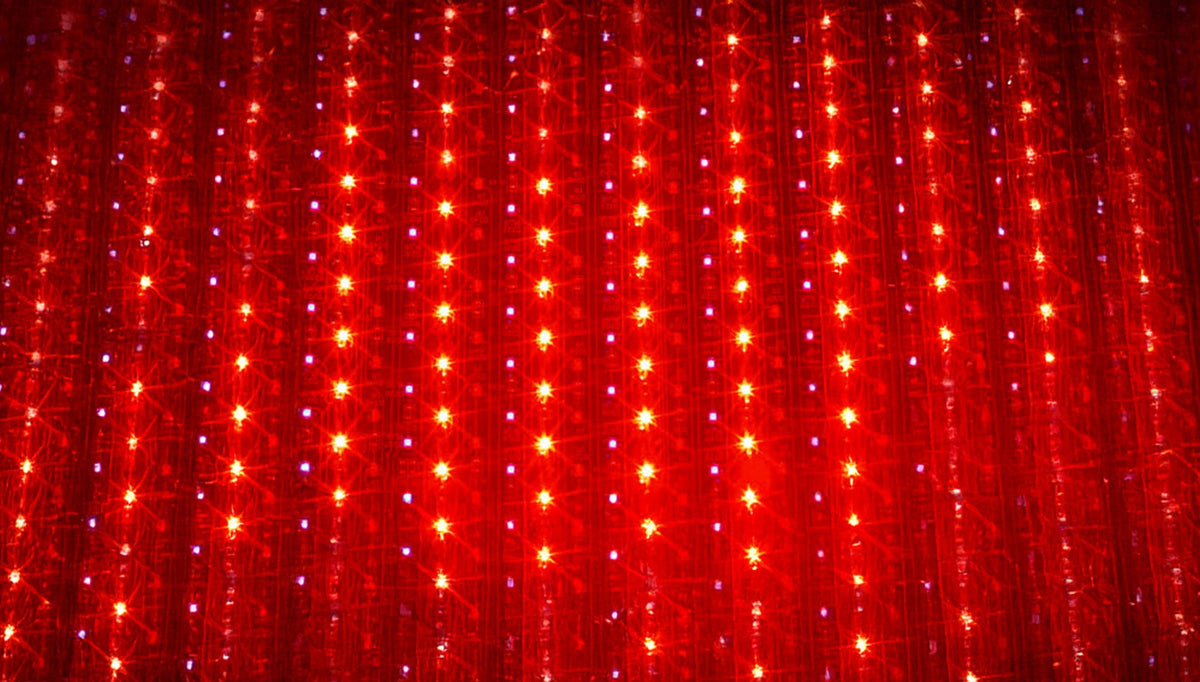 Close-up of rows of illuminated red LEDs
