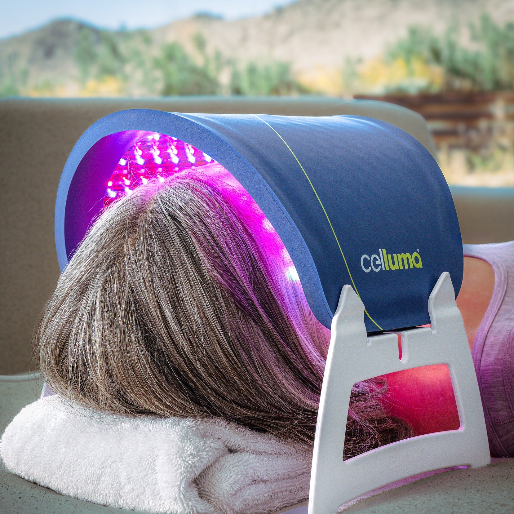 Celluma RESTORE Series 2 LED device for women's anti-aging. This 3-mode medical panel is shown on facial rest stands, positioned to treat fine lines and wrinkles. FDA-cleared and battery-powered, it uses 640nm red and 880nm near-infrared light to boost collagen and firm skin.