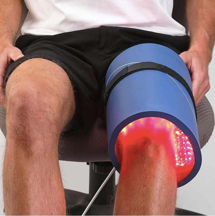 Celluma panel wrapped around a seated woman's knee