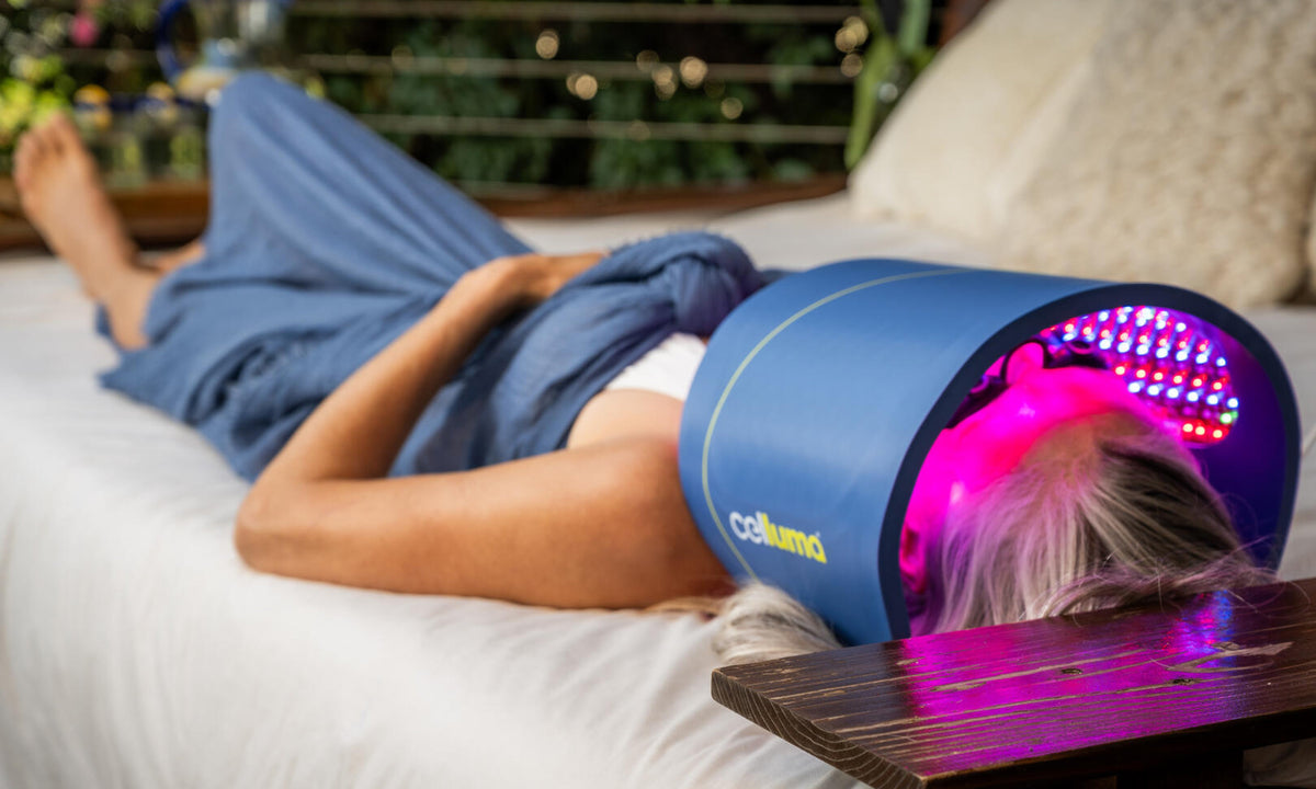 Man reclining beneath a Celluma panel outdoors