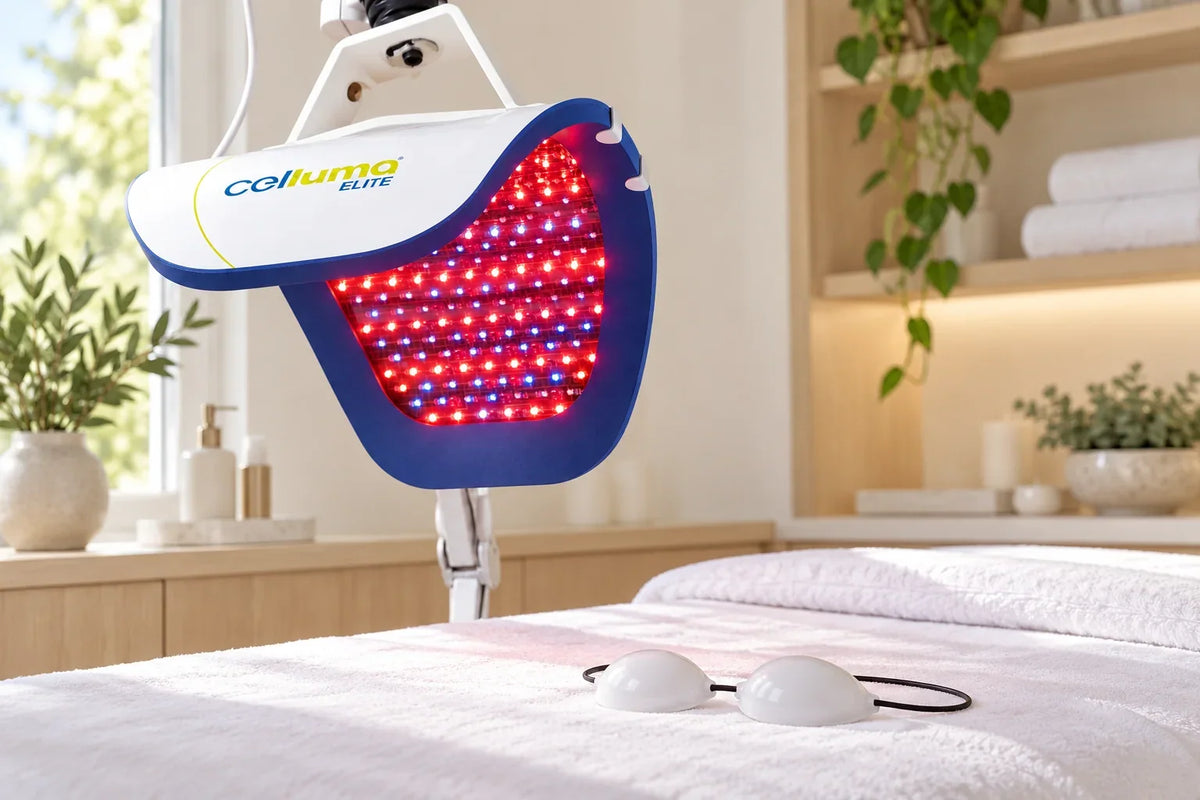 Celluma ELITE blue and red LED panel above a treatment bed with opaque eye protection