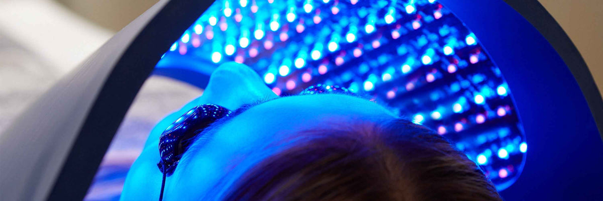 Close-up of blue LEDs above a person's head