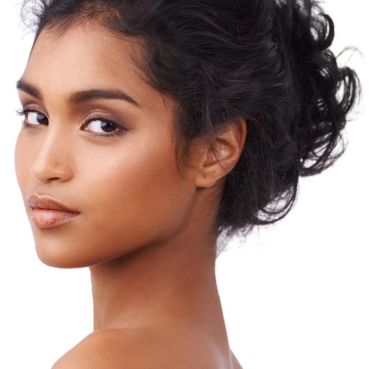 Portrait of a woman looking over her shoulder