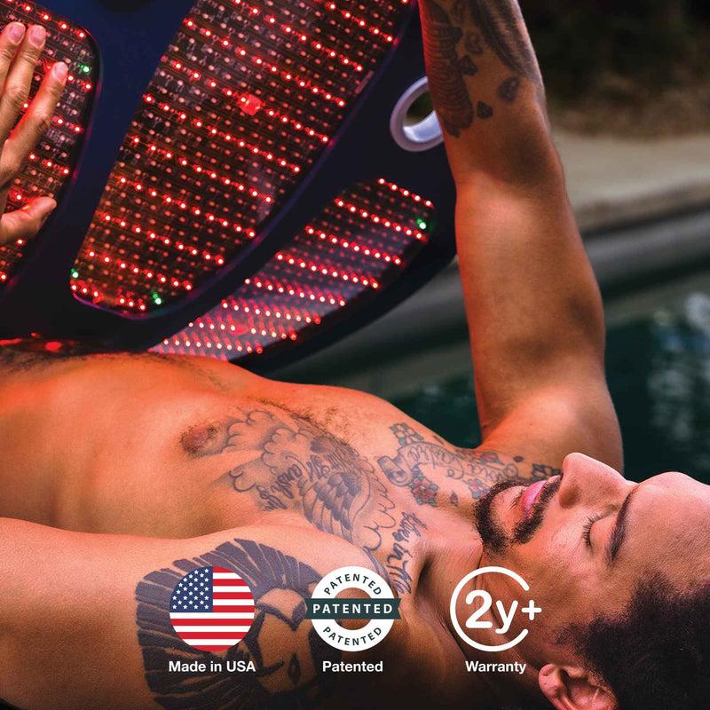 Man reclining beneath a large illuminated Celluma DELUX LED panel