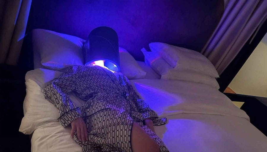 Wearing Celluma LED therapy mask to reduce wrinkles and achieve radiant skin with Celluma Singapore.
