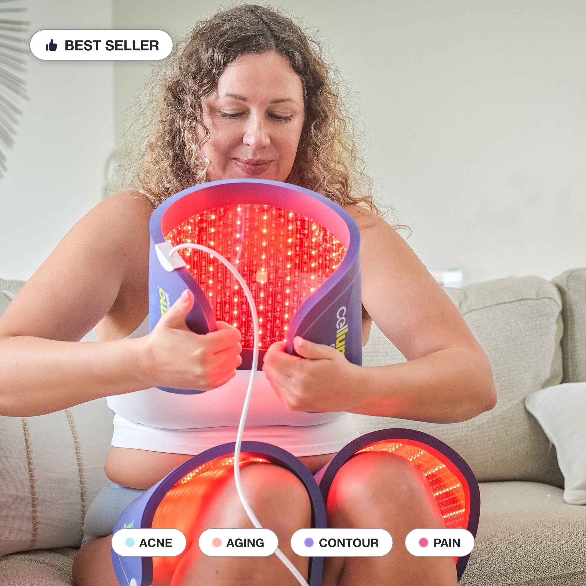 Woman using Celluma Contour 3 panels LED Red Light therapy system for body contouring on the thighs and belly. 